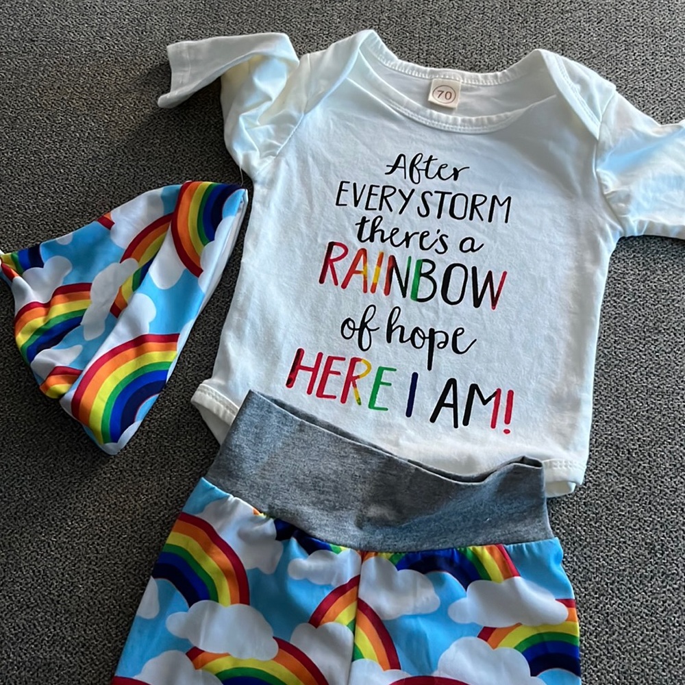 Rainbow, baby onesie, and pant set with a cute rainbow hat